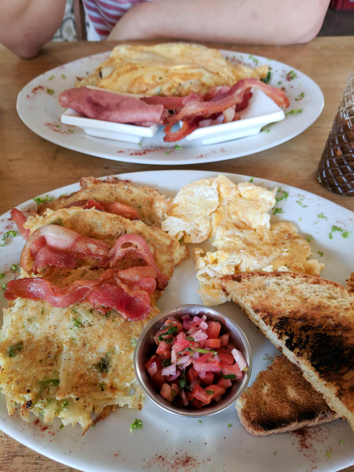 Breakfast at NOI Bistro: eggs, hash browns, toast, bacon, and salsa 