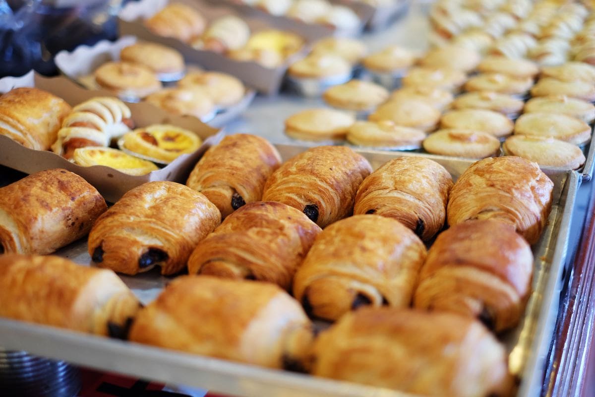 Various trays of croissants and other pastries