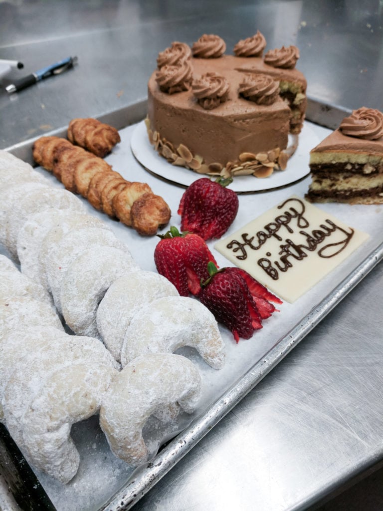 Almond crescent cookies, palmiers, and a cake