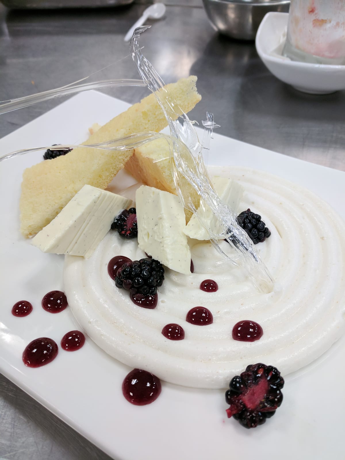 Meringue and blackberry plated dessert