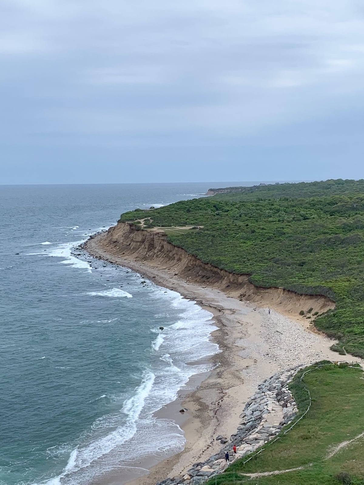 View of rocky cliffs and crashing waves