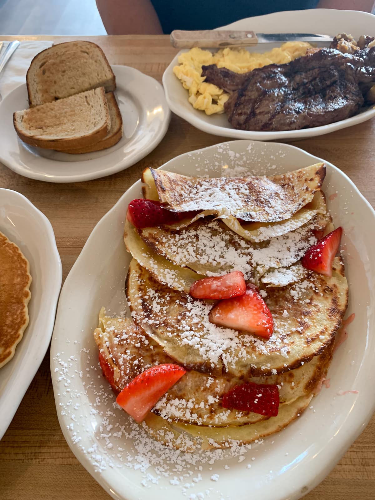 Crepes with strawberries and steak and eggs 