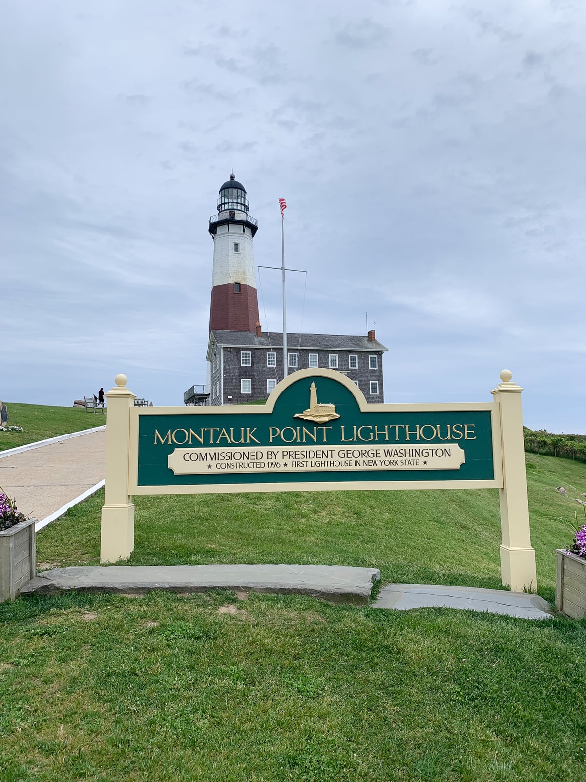 Montauk Point Lighthouse sign in front of the lighthouse
