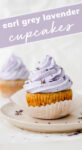 Unwrapped earl grey lavender cupcake on a plate that reads 'Earl Grey Lavender Cupcakes'