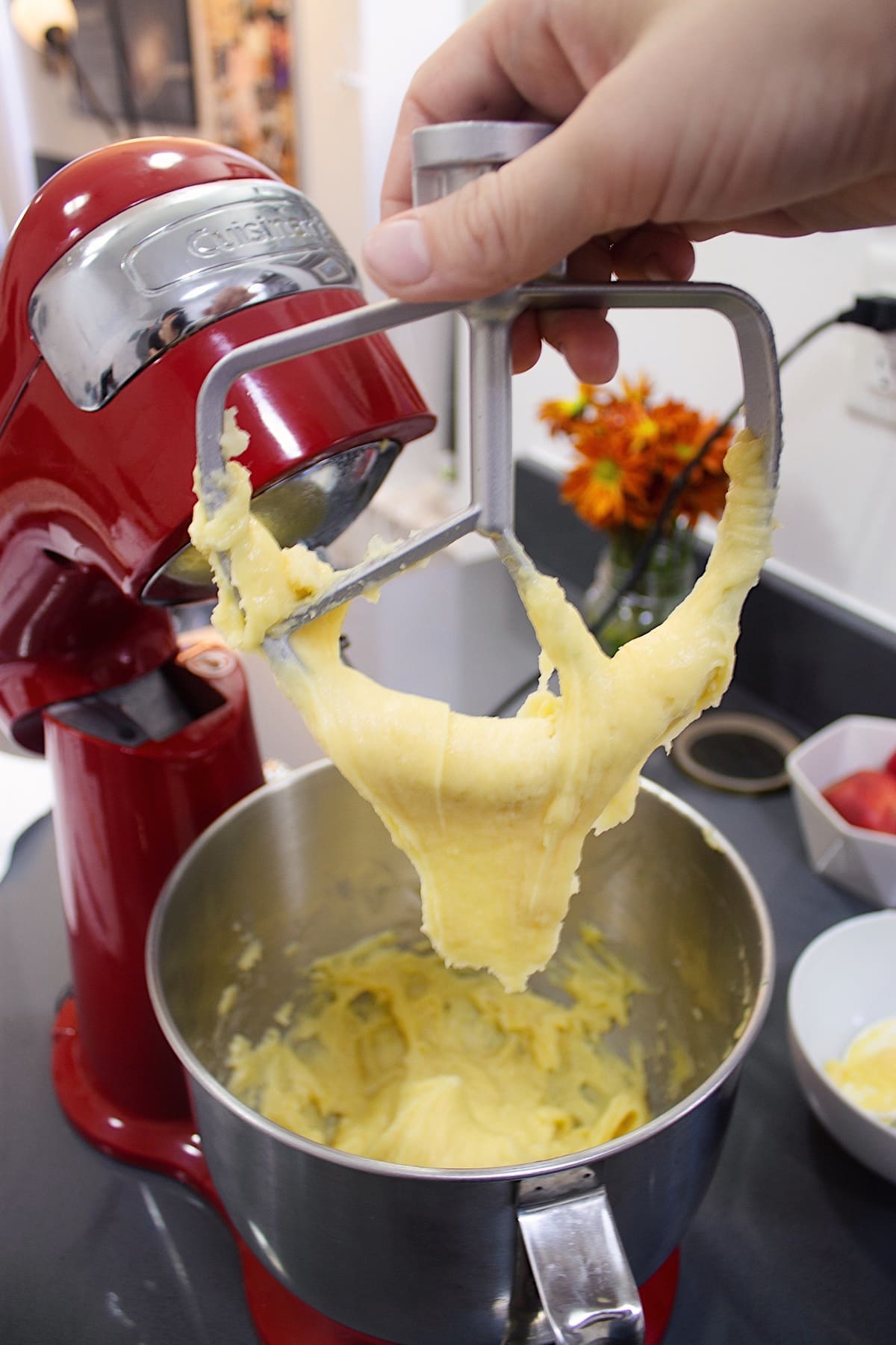 Choux pastry hanging from a paddle attachment