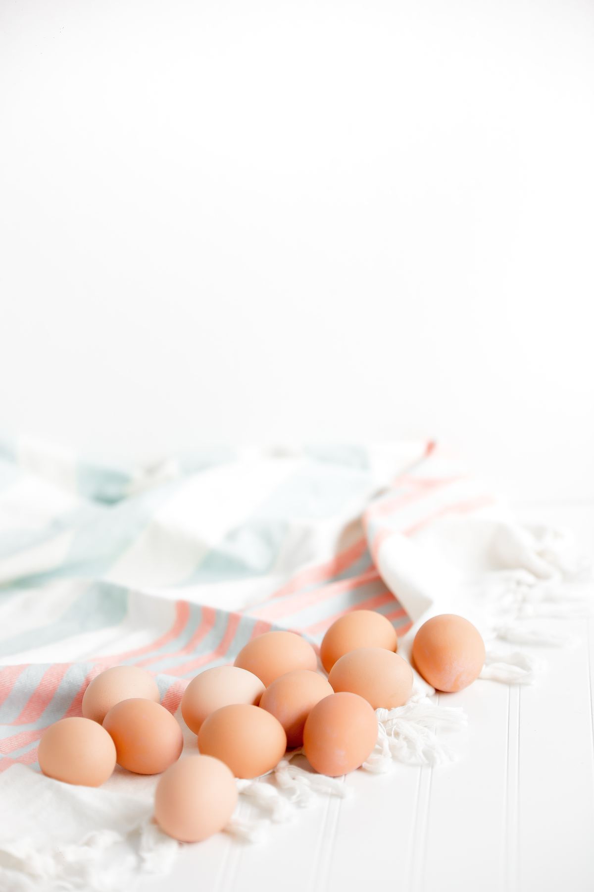 Brown eggs on a tea towel 