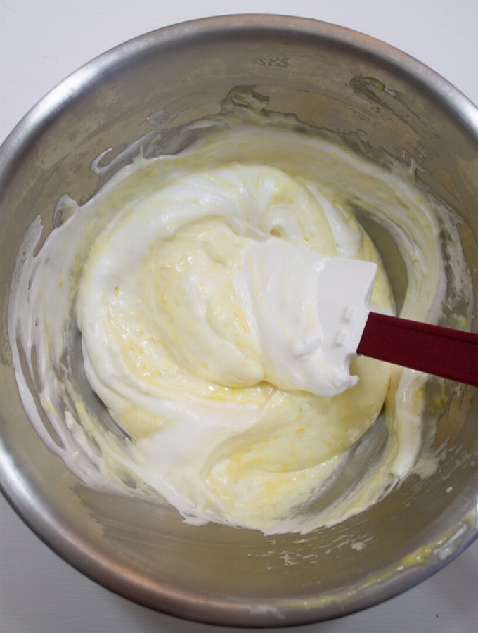 Overhead shot of bowl with cake mix and spatula sitting inside it