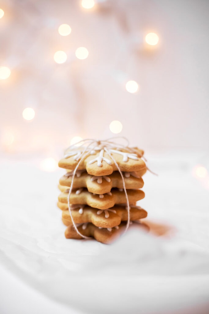 A stack of snowflake Christmas cookies tied up with twine