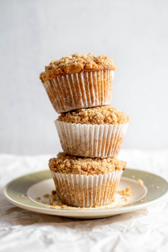 Stack of banana crumb muffins on a plate