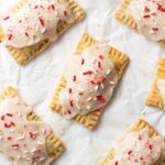 Strawberry pop tarts lying on top of parchment paper