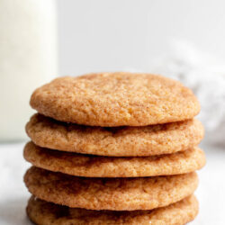 Stack of snickerdoodles with text that reads 'vegan snickerdoodles'