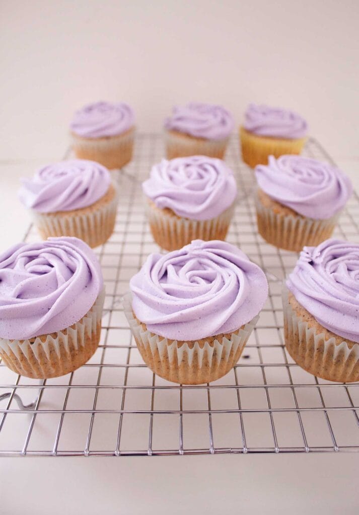 Three rows of Earl Grey and Lavender cupcakes on a cooling rack