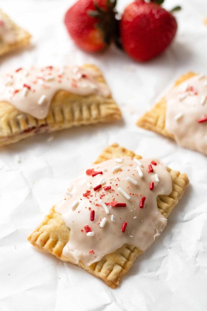 Strawberry pop tarts on top of parchment paper