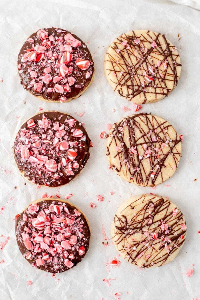 Chocolate peppermint shortbread cookies lying on parchment paper as seen from above