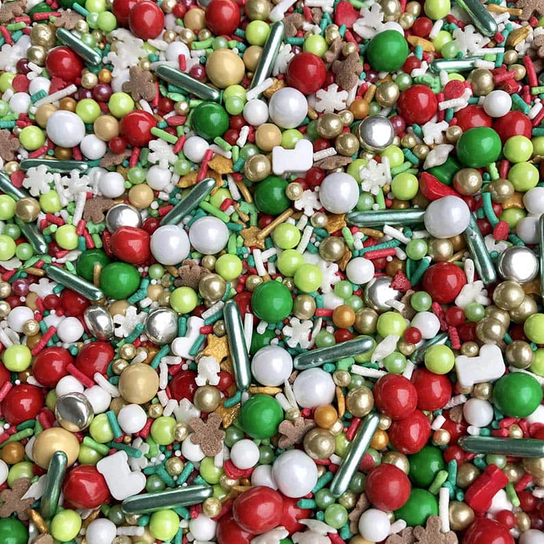 Assortment of red, green, white, and gold Christmas sprinkles 