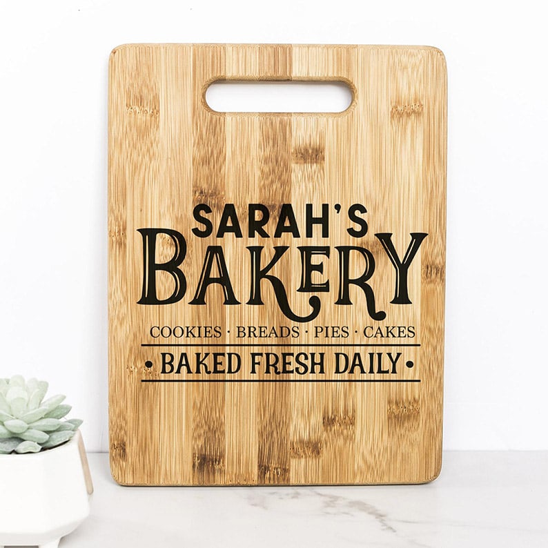 Cutting board that reads 'Sarah's Bakery - Baked fresh daily'