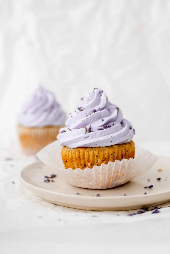 Unwrapped earl grey lavender cupcake on a plate