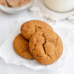 Three vegan gingerdoodles on a piece of parchment paper