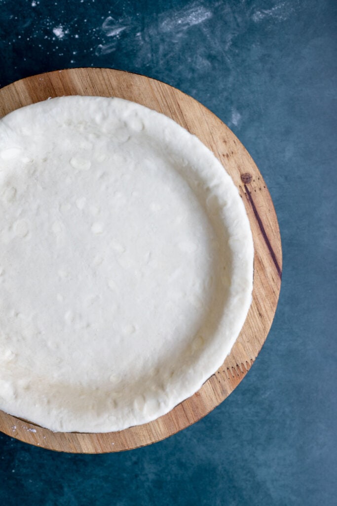 Overhead shot of shaped pie dough in a pie pan 