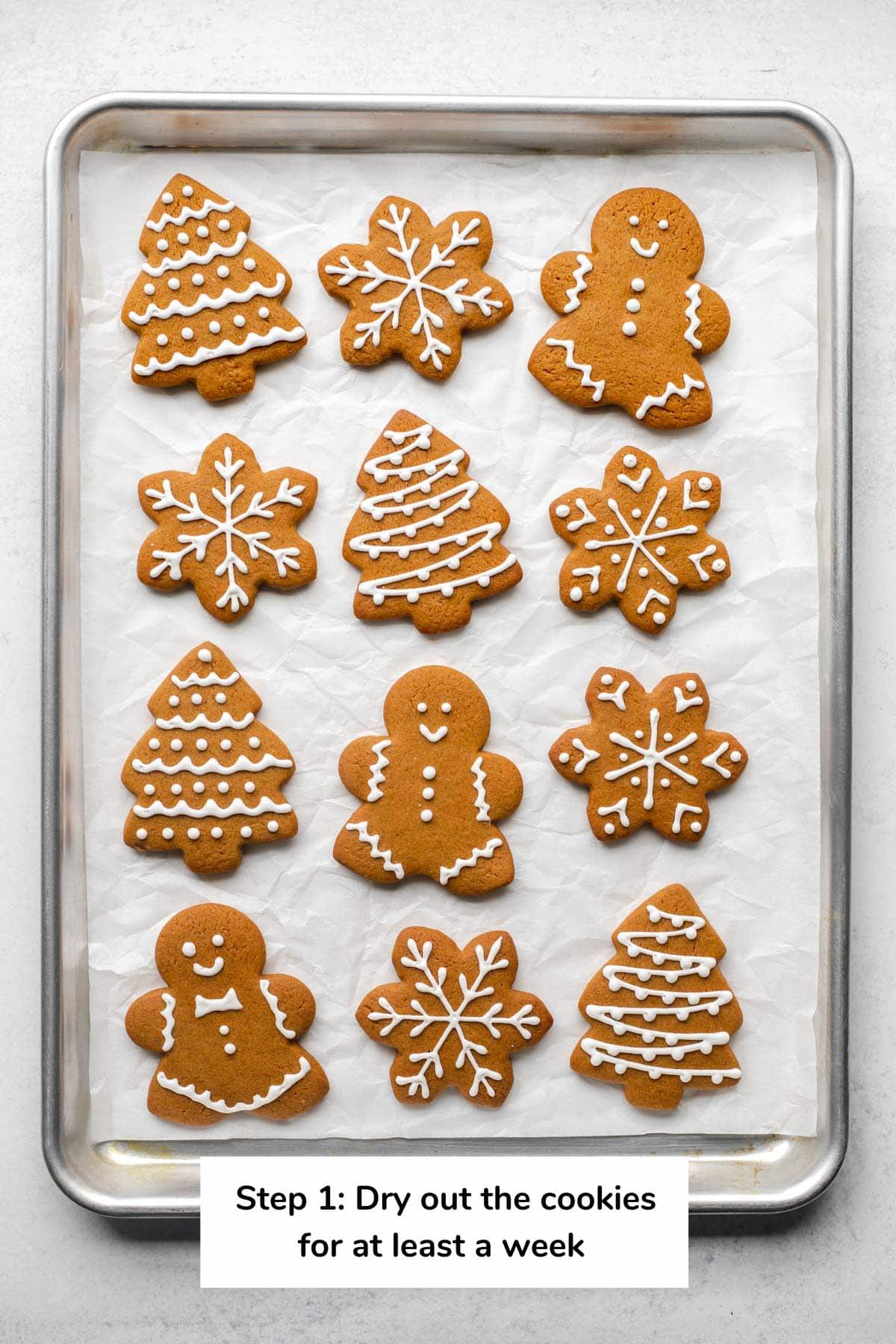Sheet tray of gingerbread cookies that reads 'Step 1: Dry out the cookies for at least a week'
