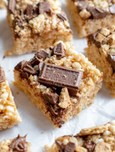 S'mores rice krispie treats on top of a piece of parchment paper
