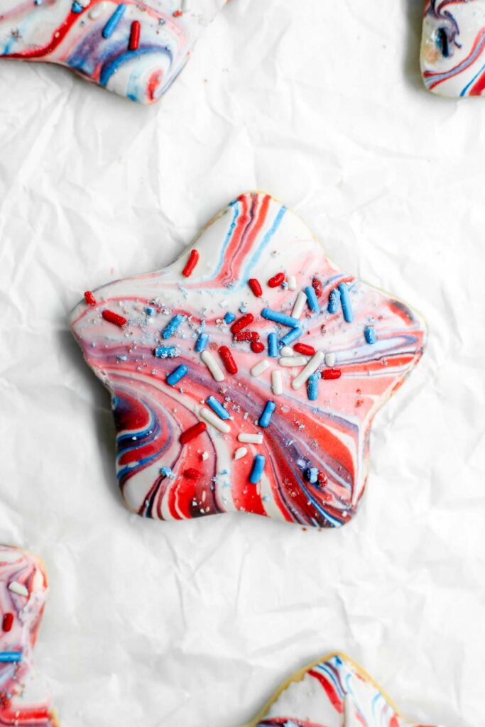 Star cookie with red, white, and blue marbled design 