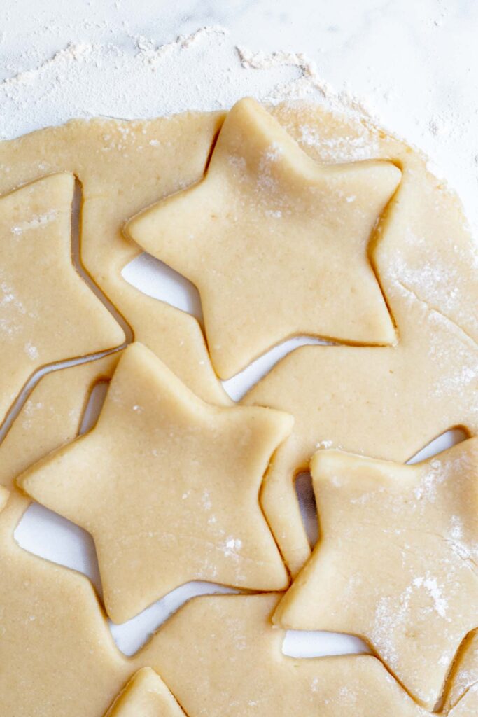 Cutting out star sugar cookies