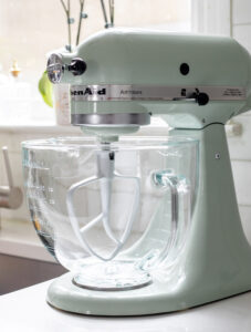 Mint green KitchenAid mixer on a kitchen counter