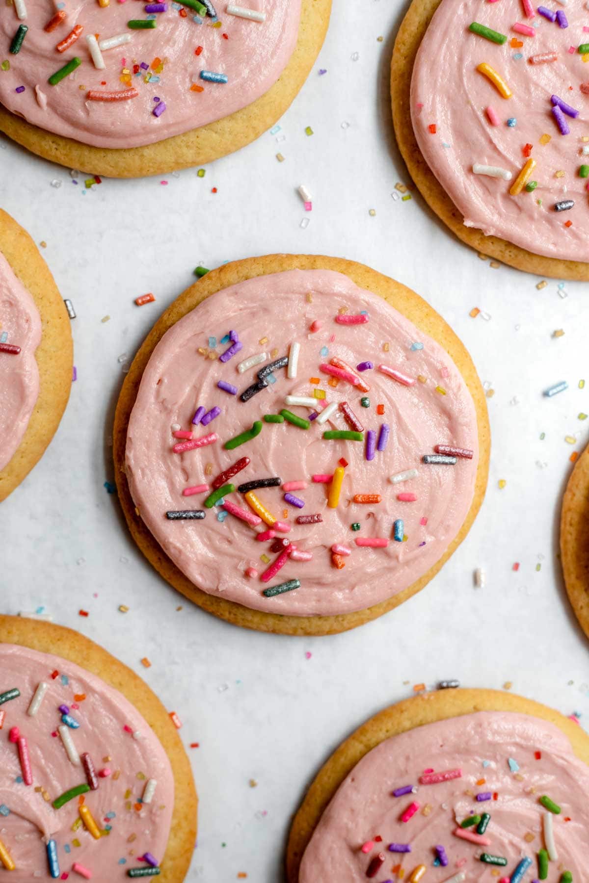 Sugar cookies with pink frosting and sprinkles 